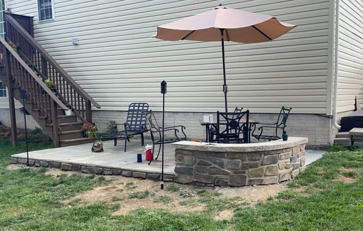 Stone Patio with stone retaining wall Stone Patio with stone retaining wall